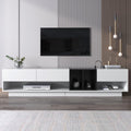 Meuble TV moderne 190 cm avec 3 tiroirs et compartiments ouverts, finition blanc brillant et noir